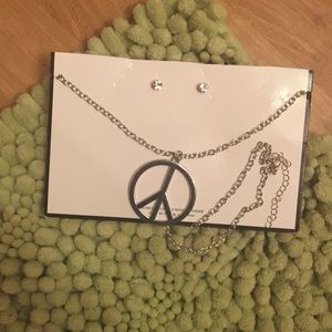 Peace sign necklace with pink stud earrings
